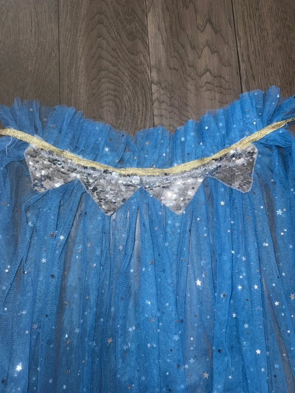 Blue Star and moon sparkle Tulle cape with silver sequence trim and a gold tie